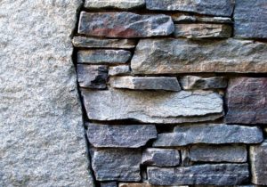 a wall with intersecting line where two different textures meet