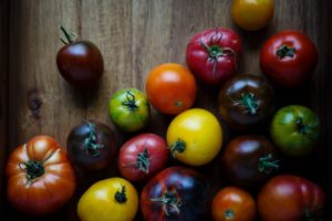 various sizes, shapes and colours of tomatoes
